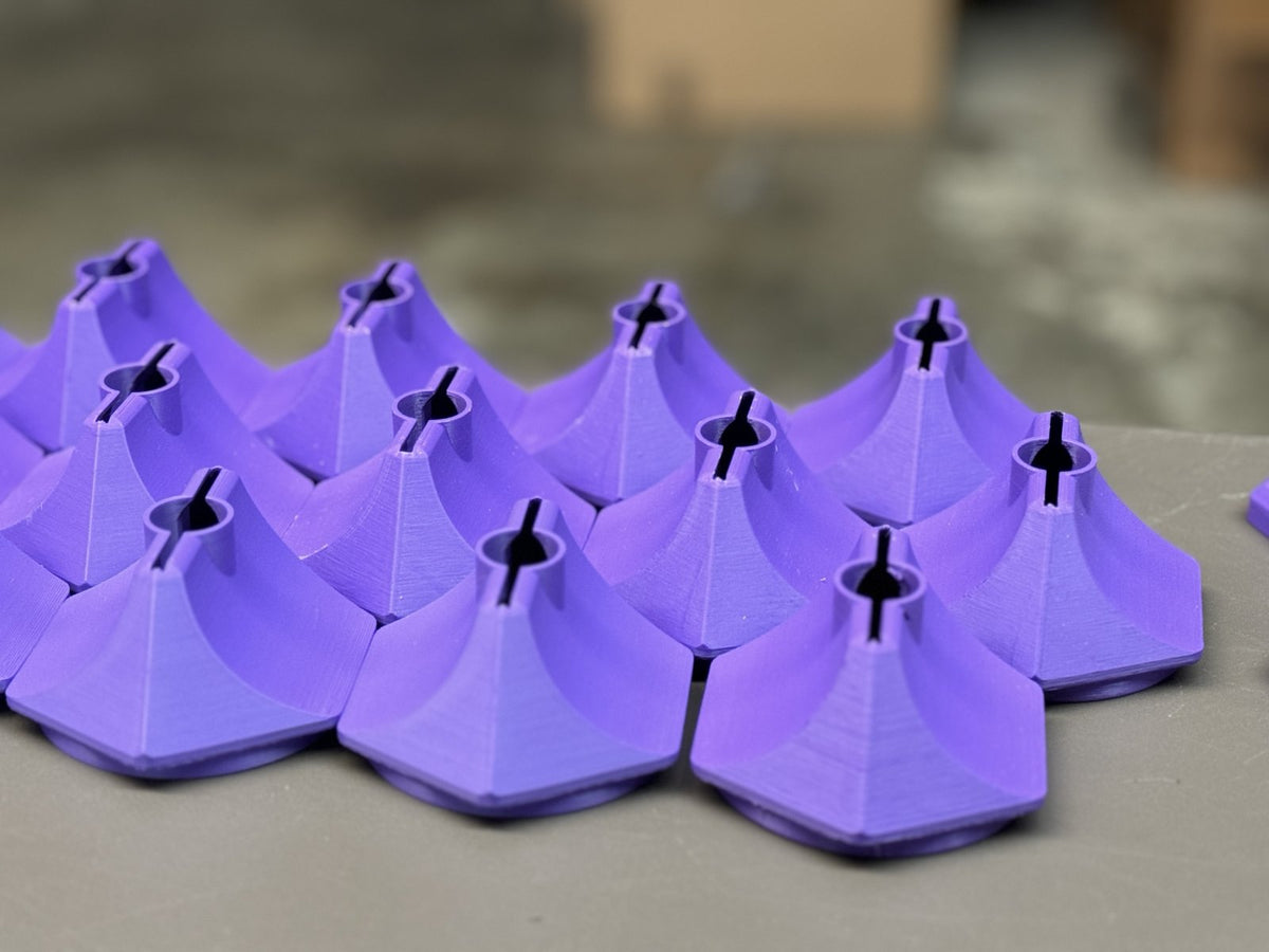 Rows of printed BLADE housings on the bench