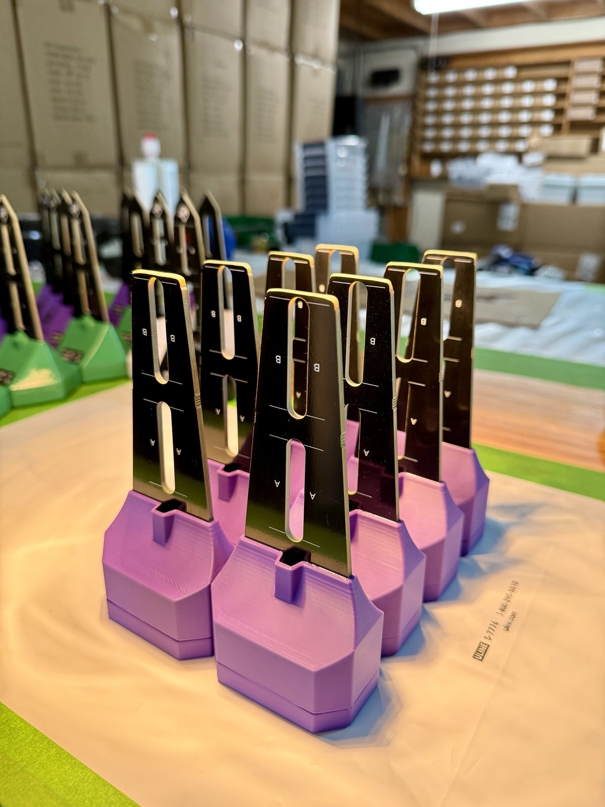 Batch of assembled BLADE sensors standing upside down while the glue cures